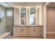 Bathroom with a double vanity, a large mirror, and a large tiled walk-in shower at 8316 Broad Peak Dr, Las Vegas, NV 89131