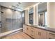 Spa-like bathroom featuring a walk-in shower with dual shower heads and a double vanity sink at 8316 Broad Peak Dr, Las Vegas, NV 89131