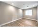 Bright, empty bedroom with hardwood floors, neutral walls, and recessed lighting at 8316 Broad Peak Dr, Las Vegas, NV 89131