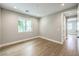 Neutral bedroom with hardwood floors and an ensuite bathroom at 8316 Broad Peak Dr, Las Vegas, NV 89131
