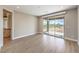 Inviting bedroom featuring wood floors and sliding glass door access to the outdoor patio at 8316 Broad Peak Dr, Las Vegas, NV 89131