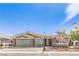 Attractive single-story home with a two-car garage, desert landscaping, and a charming street lamp at 8316 Broad Peak Dr, Las Vegas, NV 89131