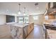 Spacious, open kitchen with a large marble island, stainless steel appliances, and stylish lighting at 8316 Broad Peak Dr, Las Vegas, NV 89131