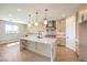 Modern kitchen with a large marble island, stainless steel appliances, ample storage, and stylish pendant lighting at 8316 Broad Peak Dr, Las Vegas, NV 89131