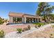 Charming backyard featuring patio, desert landscaping, and tile roof at 9520 Sundial Dr, Las Vegas, NV 89134