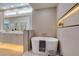 Bathroom featuring quartz countertops, dual sinks, soaking tub, and step in shower at 9520 Sundial Dr, Las Vegas, NV 89134
