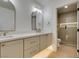 Bathroom features double sinks, modern fixtures, and a glass-enclosed shower at 9520 Sundial Dr, Las Vegas, NV 89134