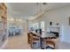 Open concept dining area with fireplace, modern lighting, and seamless connection to the kitchen, perfect for entertaining at 9520 Sundial Dr, Las Vegas, NV 89134