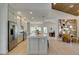 Bright, open kitchen features stainless appliances, spacious island and seamless access to the living and dining spaces at 9520 Sundial Dr, Las Vegas, NV 89134