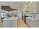 Open kitchen features a spacious island, stainless steel appliances, modern countertops, and seamless living area access at 9520 Sundial Dr, Las Vegas, NV 89134