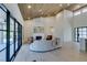 Bright living room showcases a fireplace, a modern sofa, and large sliding glass doors that provide ample natural light at 9520 Sundial Dr, Las Vegas, NV 89134