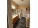 Bathroom features a double sink vanity, glass-enclosed shower, and stylish tile flooring at , Henderson, NV 89052