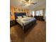 Bright bedroom boasts a king-sized bed, ceiling fan, and plenty of natural light from the windows at , Henderson, NV 89052