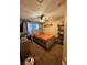 Inviting bedroom with a gray upholstered bed, fan and modern decor elements create a cozy atmosphere at , Henderson, NV 89052