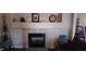Cozy fireplace with decor, a mantel and tile surround, providing a warm and inviting ambiance at , Henderson, NV 89052
