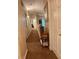 Upstairs hallway with neutral paint, plush carpet flooring, and an accent table with decorative accents at , Henderson, NV 89052