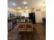 Spacious eat-in kitchen featuring gray cabinets, granite countertops, and an island with barstool seating at , Henderson, NV 89052