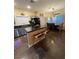 Eat-in kitchen with granite countertops, sleek appliances, and an island with barstool seating, perfect for casual dining at , Henderson, NV 89052