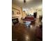 Inviting living room featuring hardwood floors, a cozy fireplace, and comfortable seating, perfect for relaxing and entertaining at , Henderson, NV 89052