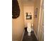 Small half bath with modern tile flooring, stylish decorations, and space-saving design features at , Henderson, NV 89052