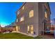 Backyard features artificial grass, outdoor seating, and a trampoline for recreation and enjoyment at 10047 Alden Creek St, Las Vegas, NV 89141