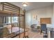 This bedroom features a bunk bed with a desk and seating area, perfect for studying or relaxing at 10047 Alden Creek St, Las Vegas, NV 89141