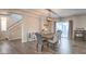 Dining room showcasing modern lighting, staircase view, and elegant furnishings, ideal for Gathering gatherings at 10047 Alden Creek St, Las Vegas, NV 89141