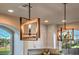 Stylish kitchen pendant lighting, adding a modern touch to the space and creating a warm ambiance at 10047 Alden Creek St, Las Vegas, NV 89141