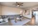 Inviting living area offering a view of the staircase and dining space, with hardwood floors and neutral decor at 10047 Alden Creek St, Las Vegas, NV 89141