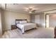 Bright main bedroom boasts a ceiling fan, neutral tones, and a relaxing atmosphere at 10047 Alden Creek St, Las Vegas, NV 89141