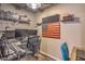 This well lit office offers a productive workspace with two monitors, custom shelving, and comfortable seating at 10047 Alden Creek St, Las Vegas, NV 89141