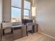 Home office featuring a built-in desk area and large windows with pleasant neighborhood views at 10047 Alden Creek St, Las Vegas, NV 89141