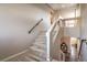 Carpeted staircase with modern railings leads to the second floor of the home at 10047 Alden Creek St, Las Vegas, NV 89141