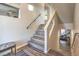 A view of the contemporary staircase leading to the home's basement recreation and theatre room at 10047 Alden Creek St, Las Vegas, NV 89141