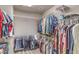Spacious walk-in closet with ample shelving, bars, and organization space for clothing at 10047 Alden Creek St, Las Vegas, NV 89141