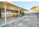 Covered patio extending from the home provides a shaded area for outdoor seating and gatherings at 1012 Greystone Dr, Las Vegas, NV 89108