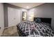 Cozy bedroom features a queen bed with wood floors and a modern ceiling light at 1012 Greystone Dr, Las Vegas, NV 89108