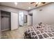 A spacious bedroom with wood flooring, a comfortable bed, and a closet provides comfortable modern living at 1012 Greystone Dr, Las Vegas, NV 89108