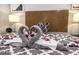 Beautiful bedroom featuring decorative swan towels on a comfortable looking bed at 1012 Greystone Dr, Las Vegas, NV 89108