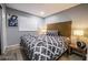 Relaxing bedroom with a plush queen bed, a stylish headboard, and wood floors at 1012 Greystone Dr, Las Vegas, NV 89108