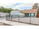 Charming single-story home with a well-maintained lawn and wrought iron perimeter fence at 1012 Greystone Dr, Las Vegas, NV 89108