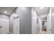 Bright hallway with neutral walls, recessed lighting, and multiple doors provides seamless transitions between rooms at 1012 Greystone Dr, Las Vegas, NV 89108
