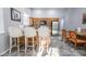 Features an efficient kitchen layout with ample countertop space, a breakfast bar, and stainless steel appliances at 1012 Greystone Dr, Las Vegas, NV 89108