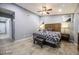 Comfortable main bedroom with wood floors, a ceiling fan, and a charming upholstered bench at 1012 Greystone Dr, Las Vegas, NV 89108