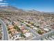 Aerial view of a neighborhood featuring a consistent architectural style and mountain backdrop at 10301 Bent Brook Pl, Las Vegas, NV 89134
