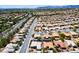 Extensive aerial shot showcasing a sprawling neighborhood with mountain views at 10301 Bent Brook Pl, Las Vegas, NV 89134