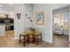 Charming dining area featuring a wine barrel table and seating near a bright window at 10301 Bent Brook Pl, Las Vegas, NV 89134