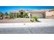 Charming single-story home with tile roof, desert landscaping, and attached two-car garage at 10301 Bent Brook Pl, Las Vegas, NV 89134