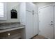 Mud room featuring built-in cabinets, counter space and exterior door at 10301 Bent Brook Pl, Las Vegas, NV 89134
