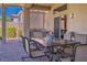 Covered patio featuring an outdoor dining area with seating, perfect for entertaining or relaxing at 10301 Bent Brook Pl, Las Vegas, NV 89134